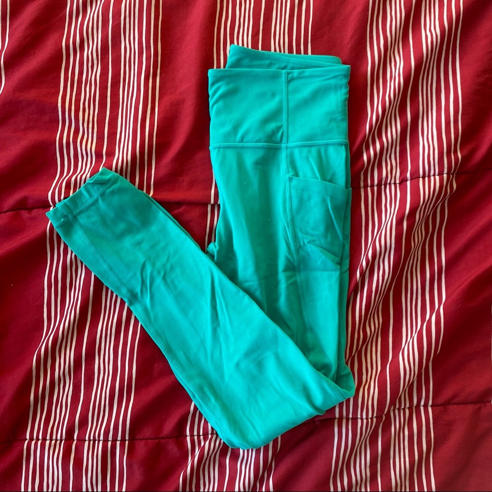 green/blue athleta salutation leggings